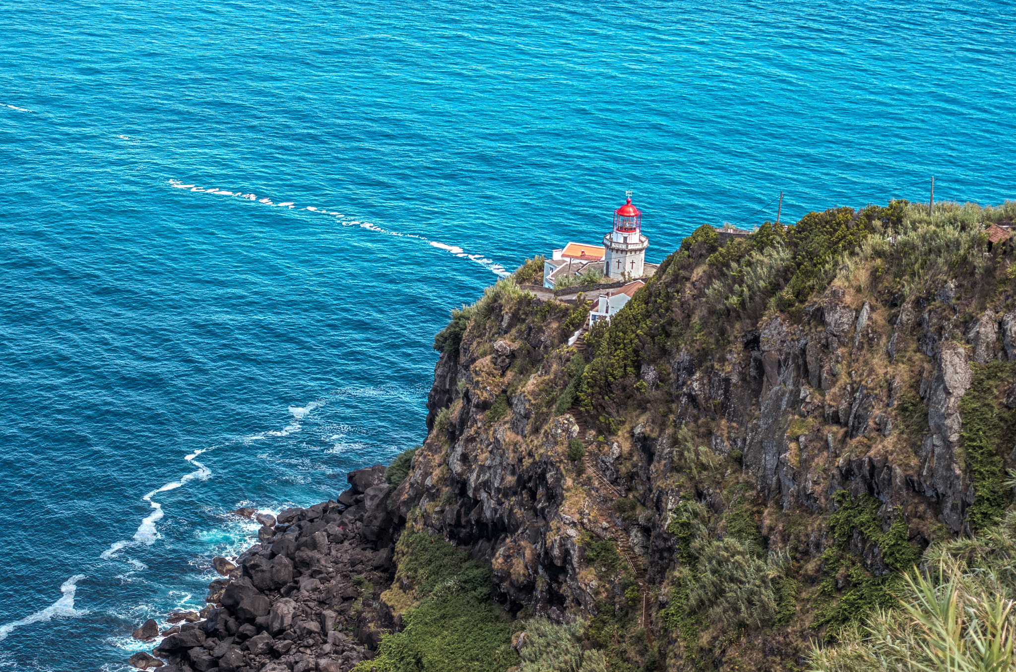 Lighthouse beam over open ocean